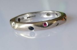 A Jeremy Hoyle carved 18ct carat white gold eternity ring with multi-coloured diamonds, size K 1/