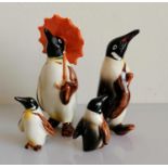 A Beswick penguin family of four, without damage or repair