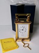 A David Peterson brass cased 8-day carriage clock with Roman numerals, as new with original