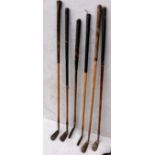 A mixed set of ten wood-shafted vintage golf clubs and putters by: Thistle Brand, Dunlop, JS