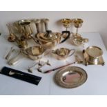 A selection of silver plated items to include a three-piece Unity Plate tea service, goblets, wine