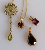 An Edwardian peridot and seed pearl pendant on a gold chain, a teardrop garnet pendant on chain, one