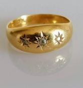 An 18ct yellow gold gypsy ring with three inset diamonds, size N, 2.67g