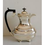 A George V coffee or hot water pot with fruitwood handle and finial, gadrooned rim, bulbous body,