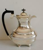 A George V coffee or hot water pot with fruitwood handle and finial, gadrooned rim, bulbous body,