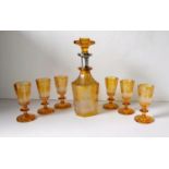 A 19th century Bohemian amber glass decanter with silver collar, 20.5 cm, etched glade scene,
