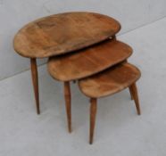 A nest of 3 Ercol elm and beech pebble occasional tables, middle table cracked, all with stains