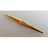 An 18ct yellow gold stick brooch with six graduated brilliant-cut diamonds, largest 0.10 carat,