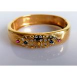 A multi-stone cushion-shape hinged bangle with two square mixed-cut sapphires, each 2.9mm x 2.9mm, a