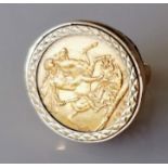 A George V gold full-sovereign ring on a 9ct gold mount, hallmarked, size K, dated 1913, Melbourne