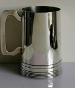 A mid-century silver tankard of plain form by Walker & Hall, Sheffield, 1950, 14 cm H, 415g with