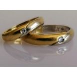 Two Italian bi colour gold wedding bands with diamond insets, sizes U, K, stamped 750, 9.3g