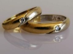 Two Italian bi colour gold wedding bands with diamond insets, sizes U, K, stamped 750, 9.3g