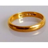 A 22ct yellow gold wedding band, size S, hallmarked, 4.3g