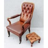 A George IV walnut-framed library or club chair with later footstool, leather button-back