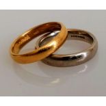 A 22ct yellow gold wedding band, 4.26g and a white 18ct gold wedding band, both size L and