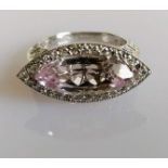 An 18ct white gold, diamond, and kunzite dress ring, the marquise-cut pale lilac kunzite set