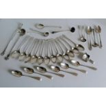 A George III set of twelve crested teaspoons, two salt spoons and a ladle by George Smith IV,