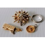 A Victorian-style star brooch with pearl decoration on yellow metal, unmarked, 8.9g together with