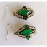 A pair of Art Deco marquise-cut emerald earrings on a silver frame with zirconia decoration, each