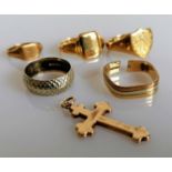 Three yellow gold signet rings, two mid-century rings and a crucifix, all hallmarked 9ct, various
