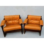 A pair of Percival Lafer lounge chairs with hardwood frames and leather upholstery, labelled Lafer