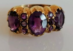 A mid-century 9ct yellow gold three-stone amethyst dress ring, largest 10mm x 8mm; 8mm x 5mm