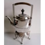 A Victorian silver tea kettle with gadroon decoration, urn finial (slightly damaged) on a conforming