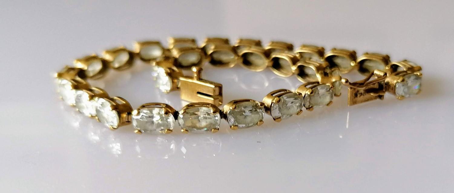 A 14ct yellow gold line or tennis bracelet with cubic zirconia decoration, box clasp, 20 cm,