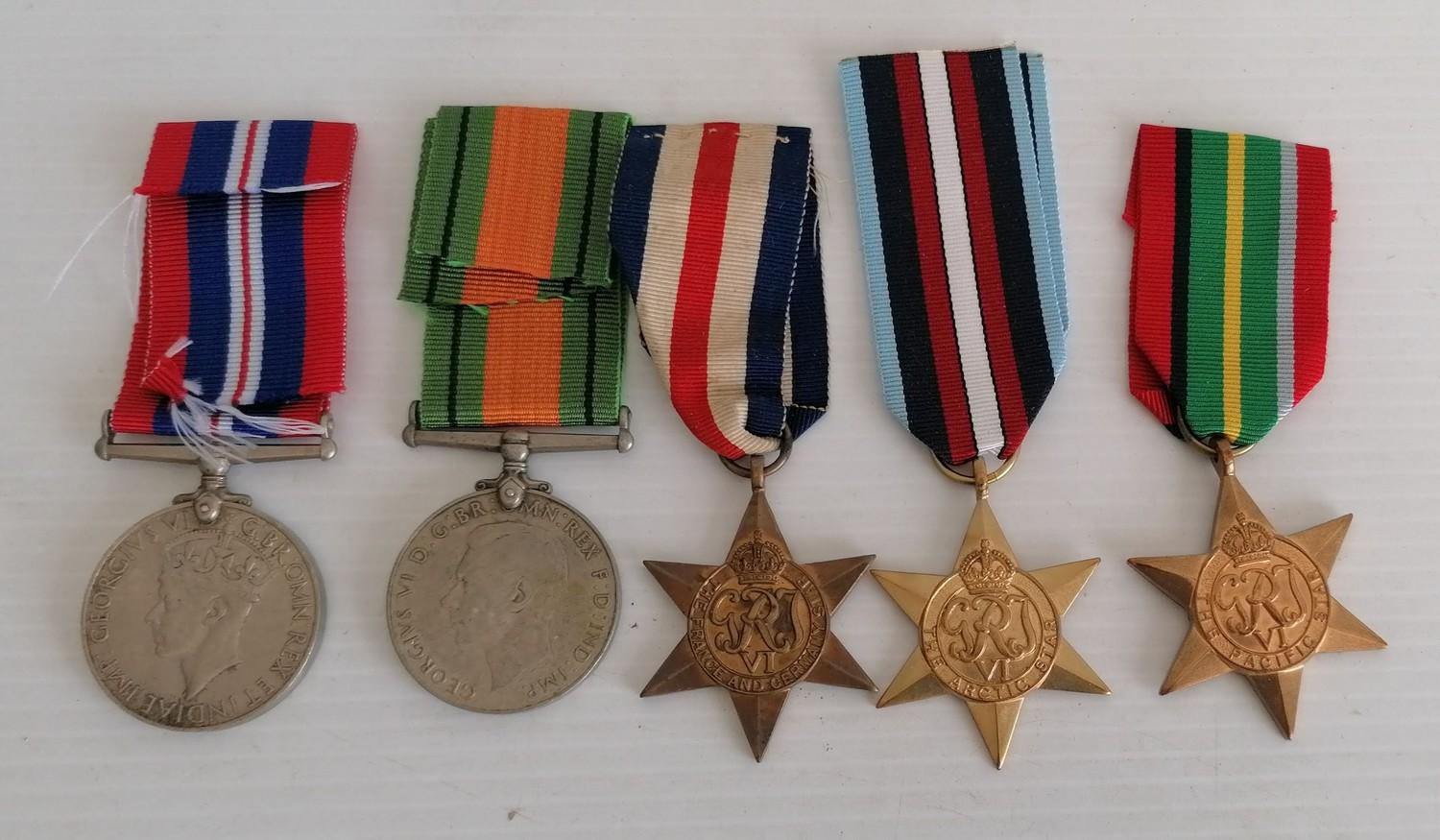 A WW2 medal group to include: 1939-1945 medal, Defence medal and replicas of Pacific Star, France