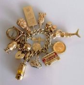 A 9ct gold charm bracelet including a George V gold full-sovereign, 1927, South Africa mint, a
