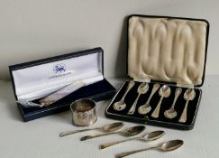 A George V cased set of six silver coffee spoons by W H Haseler Ltd., Birmingham, 1922; four