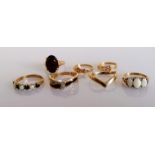 An assortment of seven yellow gold rings, some gem-set, all hallmarked or stamped 9ct, various sizes