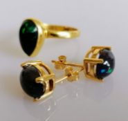 A teardrop-shape fire opal ring on a silver gilt shank, size O and a close match pair of earrings on
