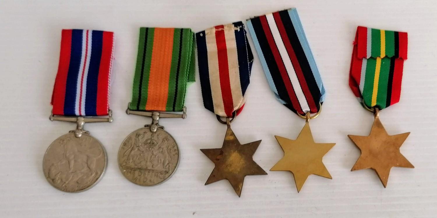 A WW2 medal group to include: 1939-1945 medal, Defence medal and replicas of Pacific Star, France - Image 2 of 2