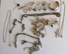 A silver charm bracelet, fob chains and other silver-based jewellery, together with an Art Nouveau-