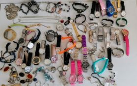 A large assortment of fashion watches and some costume jewellery, etc