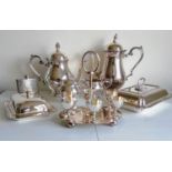 An assortment of silver plate to include a four-piece tea and coffee service, two food warmers, an