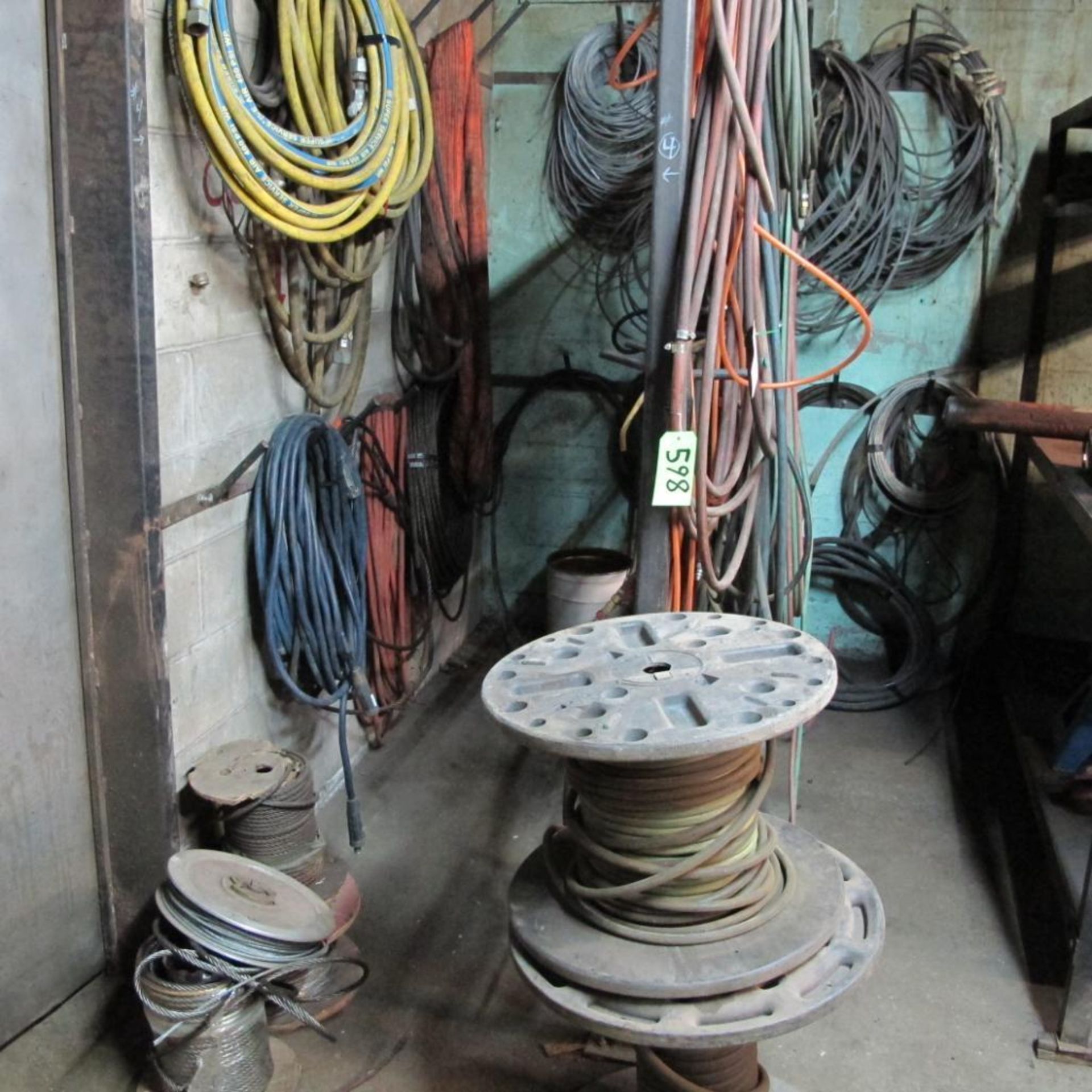 LOT OF HANGING CABLES, WIRE SLINGS, HOSES, STEEL CABLES, WIRE REELS AND HOSES (LOWER CRIB)
