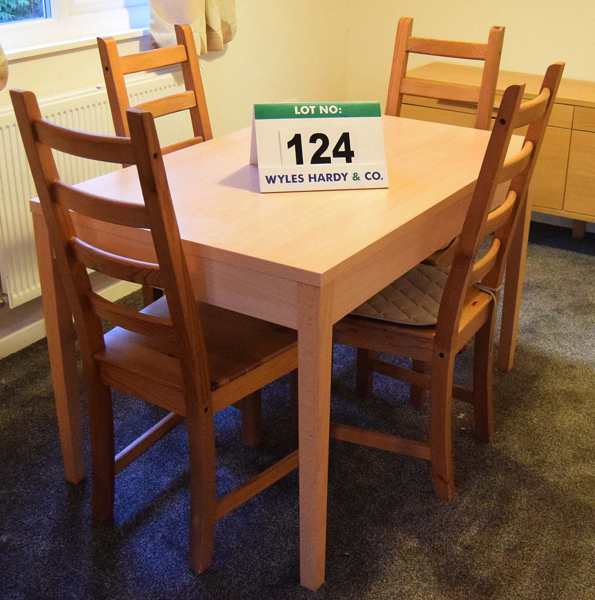 A Beech Veneer Table and Four Ladder Back Timber Framed Chairs