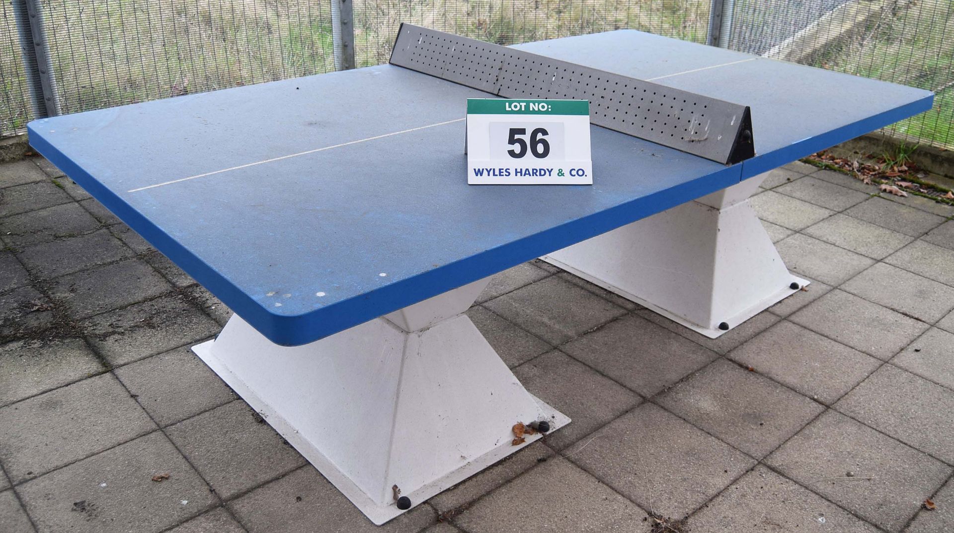 An Unbadged Moulded Fibreglass Sectional All Weather Table Tennis Table