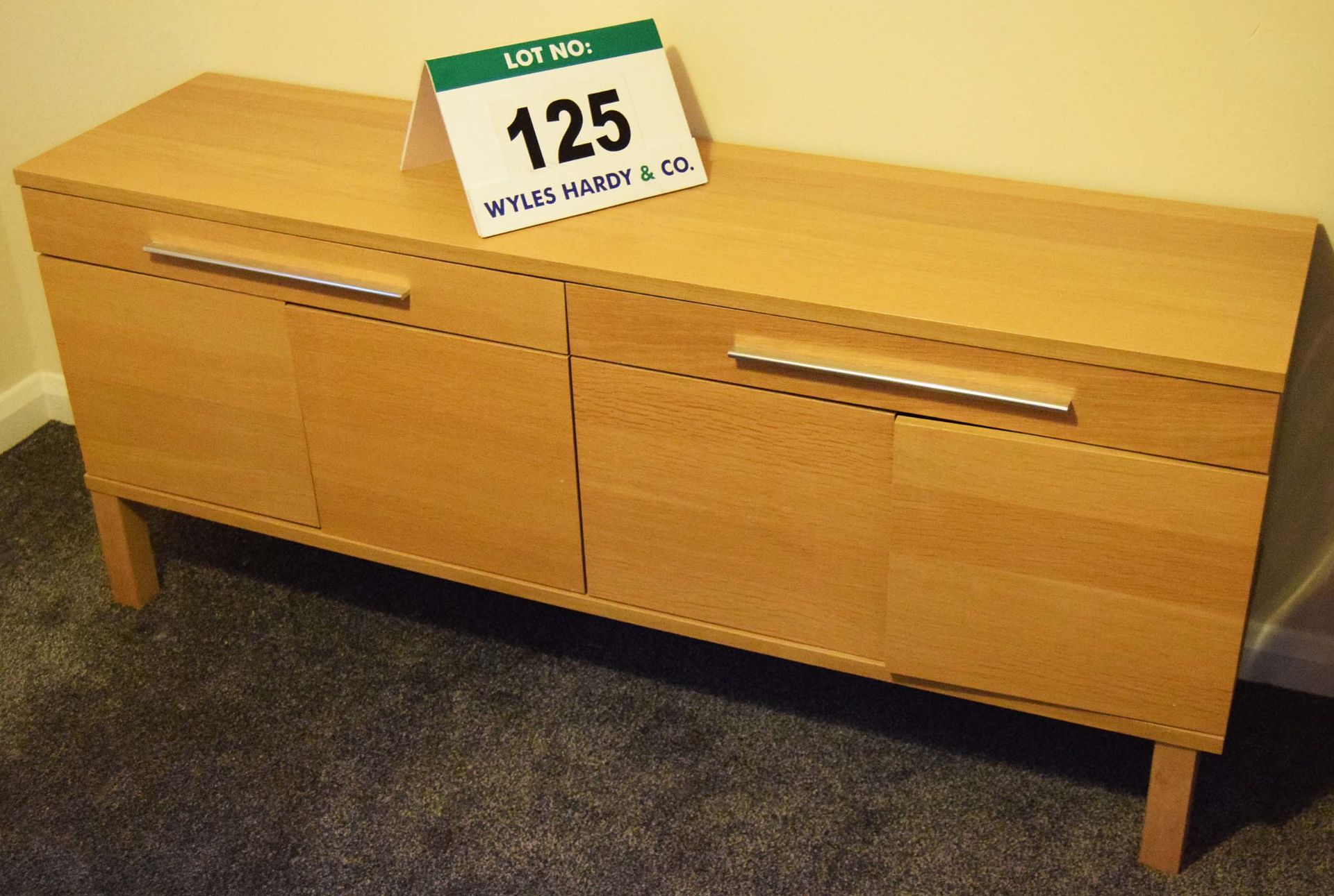 A Beech Veneer Sideboard with Twin Drawers Over Two Double Door Cupboards