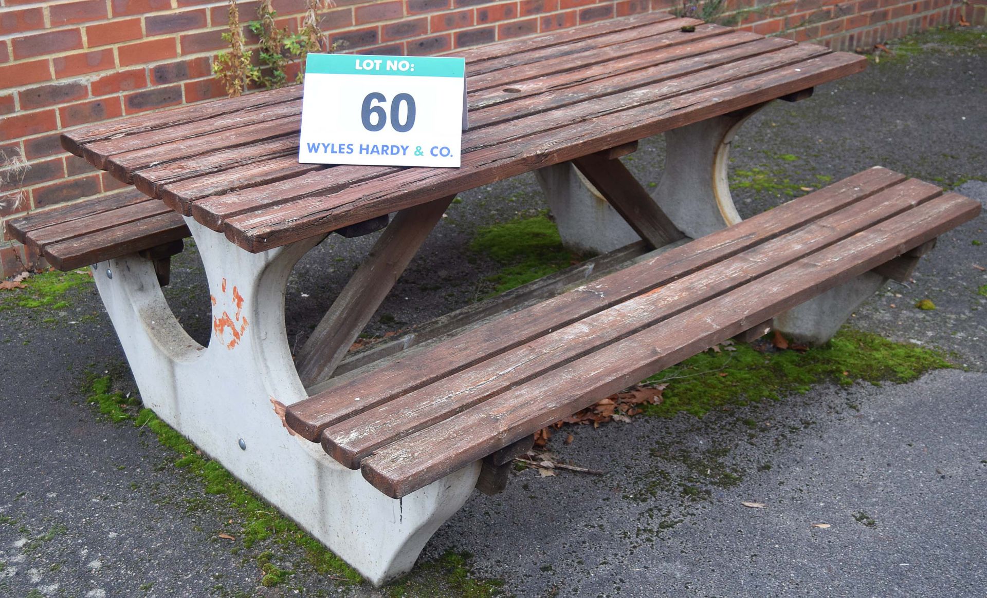 A Cast Concrete and Timber Picnic Bench