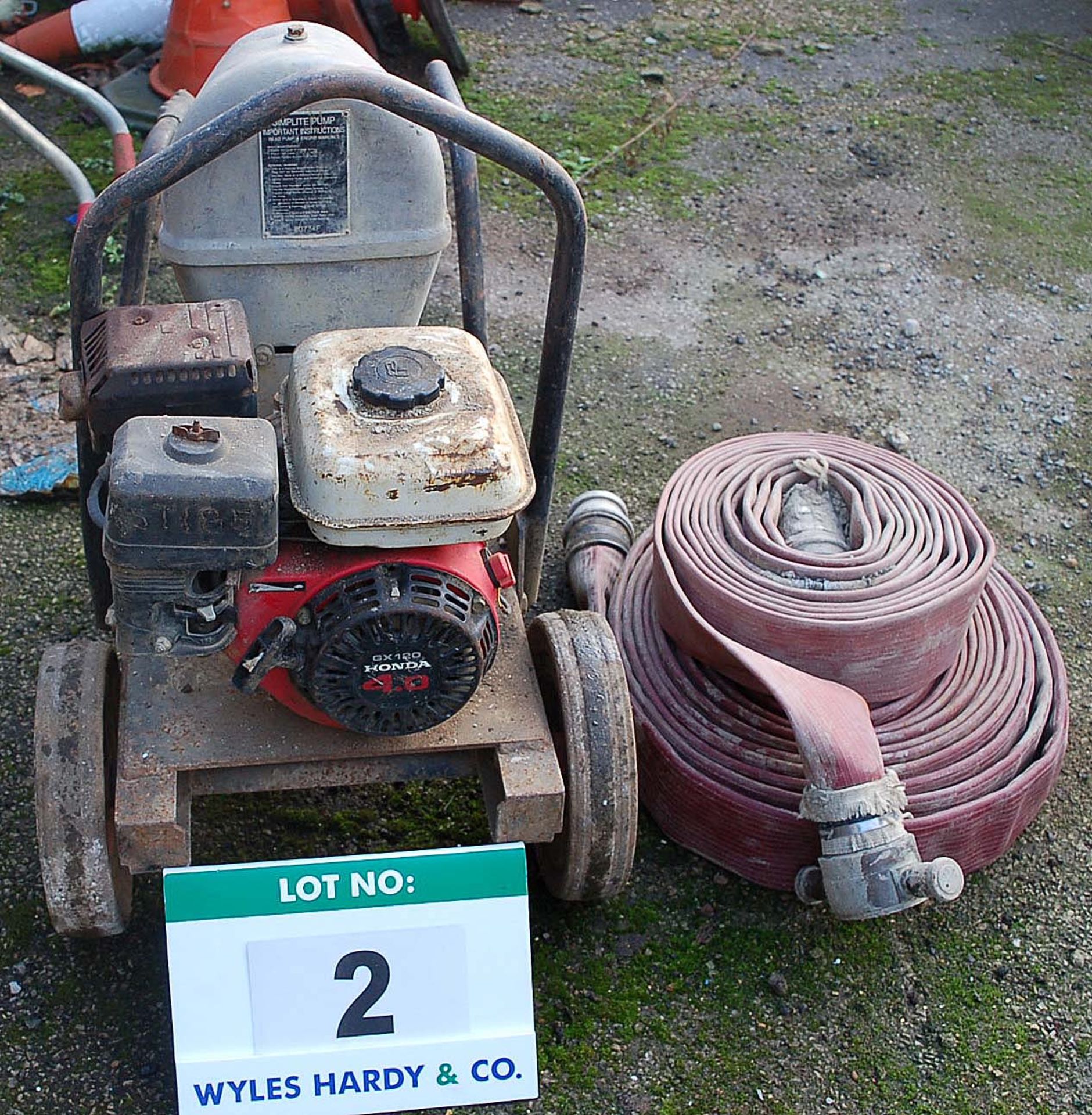 A SELWOOD SIMPLITE Portable Petrol Powered Water Pump Serial Number: 80734F with 2 Hoses - as
