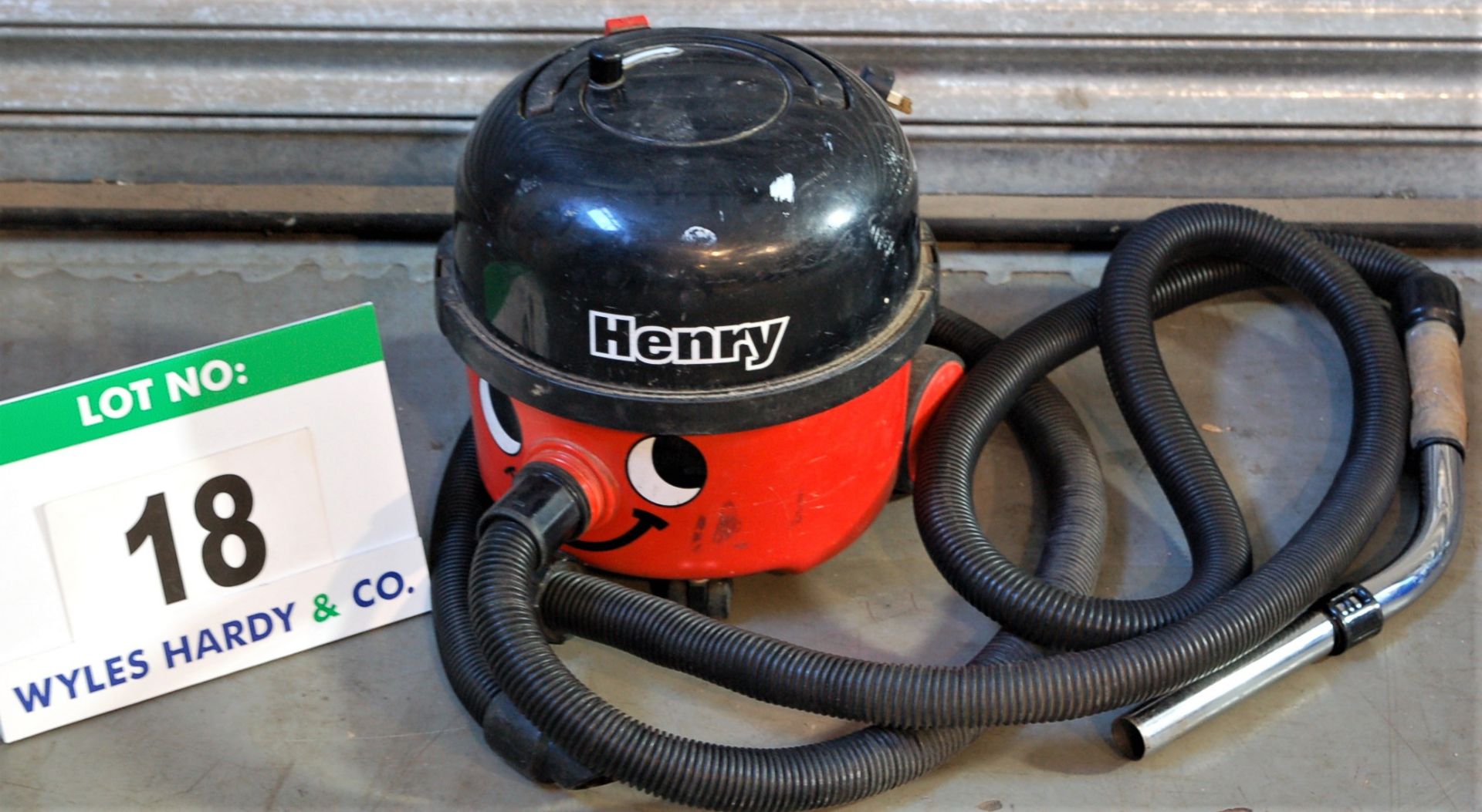 A NUMATIC Henry Vacuum Cleaner with Spare Hose