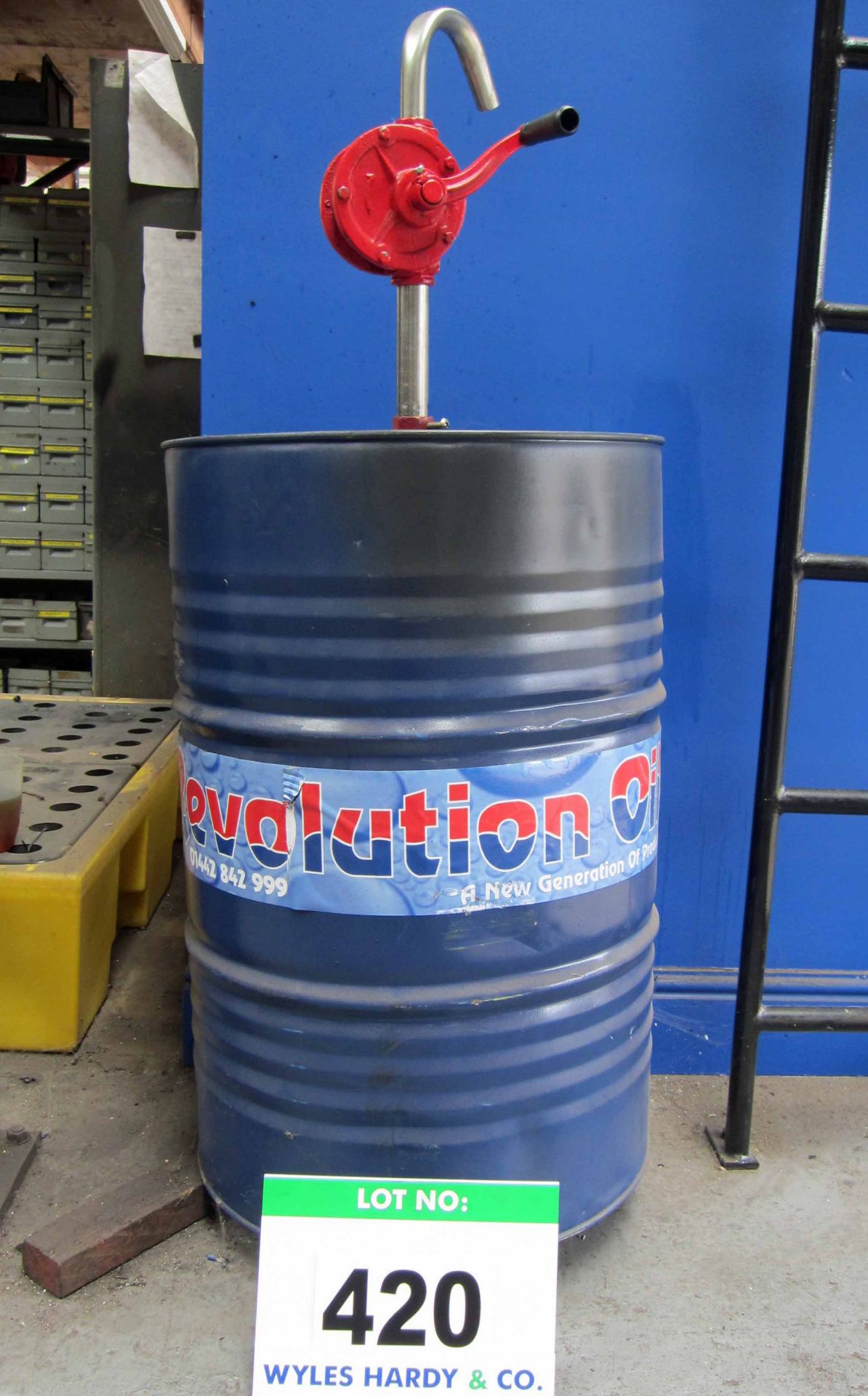 A Part (Approx. 50 per cent) Barrel of REVOLUTION OIL ISO46 Hydraulic Oil and A Manual Rotary Drum