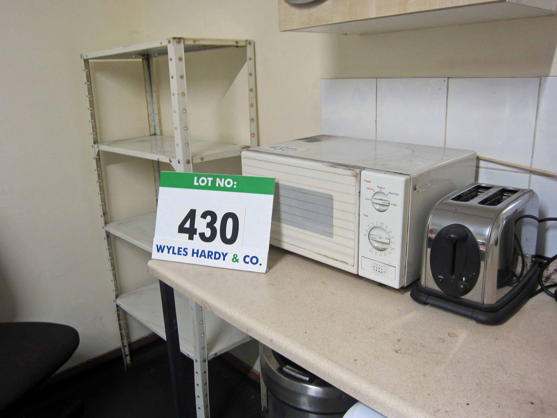 The Tea Room Furniture and Equipment including Two Tables, Four Chairs, A Steel Shelf, A Microwave