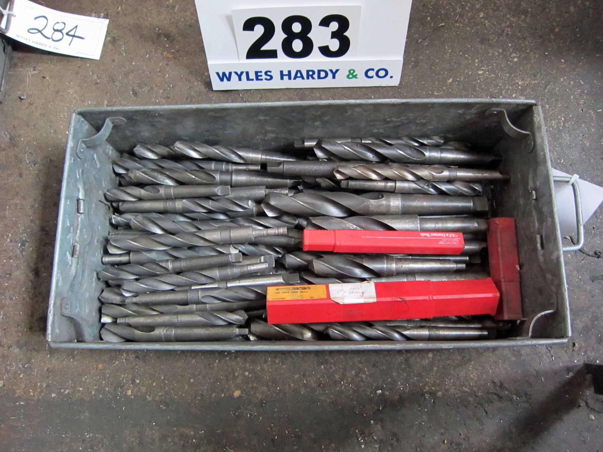 Over Fifty Various 20mm x to 34mm Drill Bits in A Steel Tote Bin