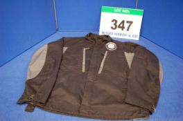 A Used Black and Grey Cotton Mechanics Jacket with Bristol Badge on Upper Left Chest Panel with