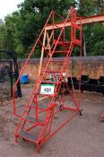 An Unbranded Red Steel Mobile 9-Tread Staircase